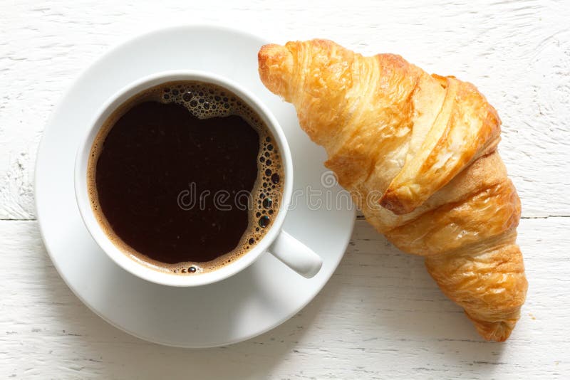 croissant-coffee-rustic-white-wood-above-55714104.jpg